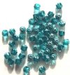 50 6mm Triangle Faceted Aqua, Silver Tipped with Coated Ends